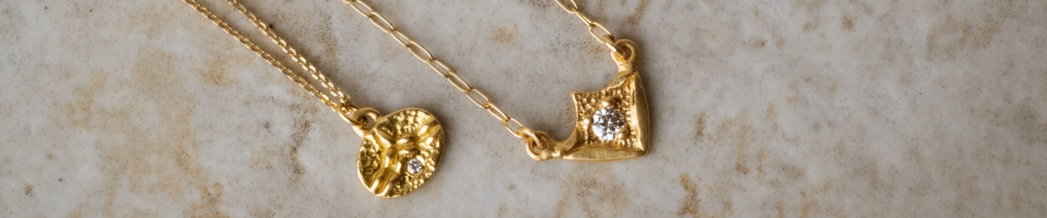 hand-carved gold and precious gemstones that evoke an old world aesthetic, it is a touchstone for your life–the transient marked by the enduring.