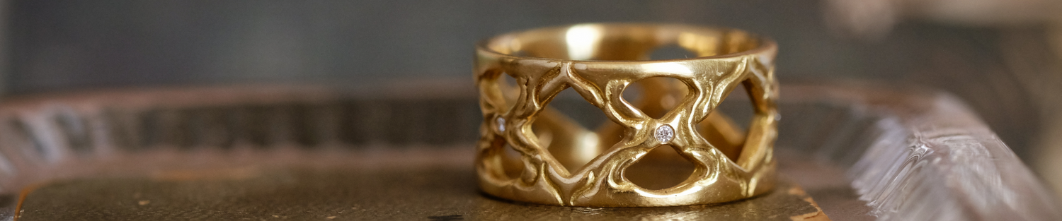 hand-carved gold and precious gemstones that evoke an old world aesthetic, it is a touchstone for your life–the transient marked by the enduring.