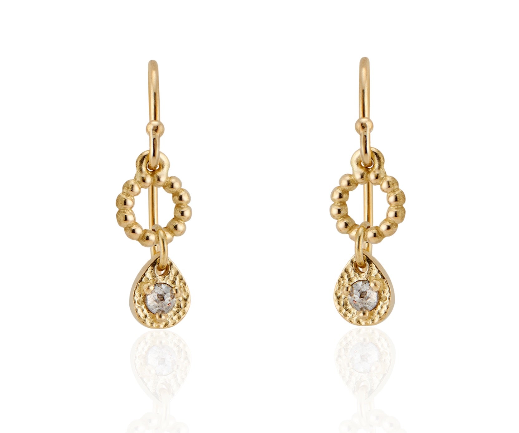 A romantic journey that transcends time. The Drop earring merges a circle of understated gold beads with ornate rose cut diamonds for a dangling romantic style that feels as at home today as it does in an antique jewelry box.