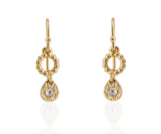 A romantic journey that transcends time. The Drop earring merges a circle of understated gold beads with ornate rose cut diamonds for a dangling romantic style that feels as at home today as it does in an antique jewelry box.