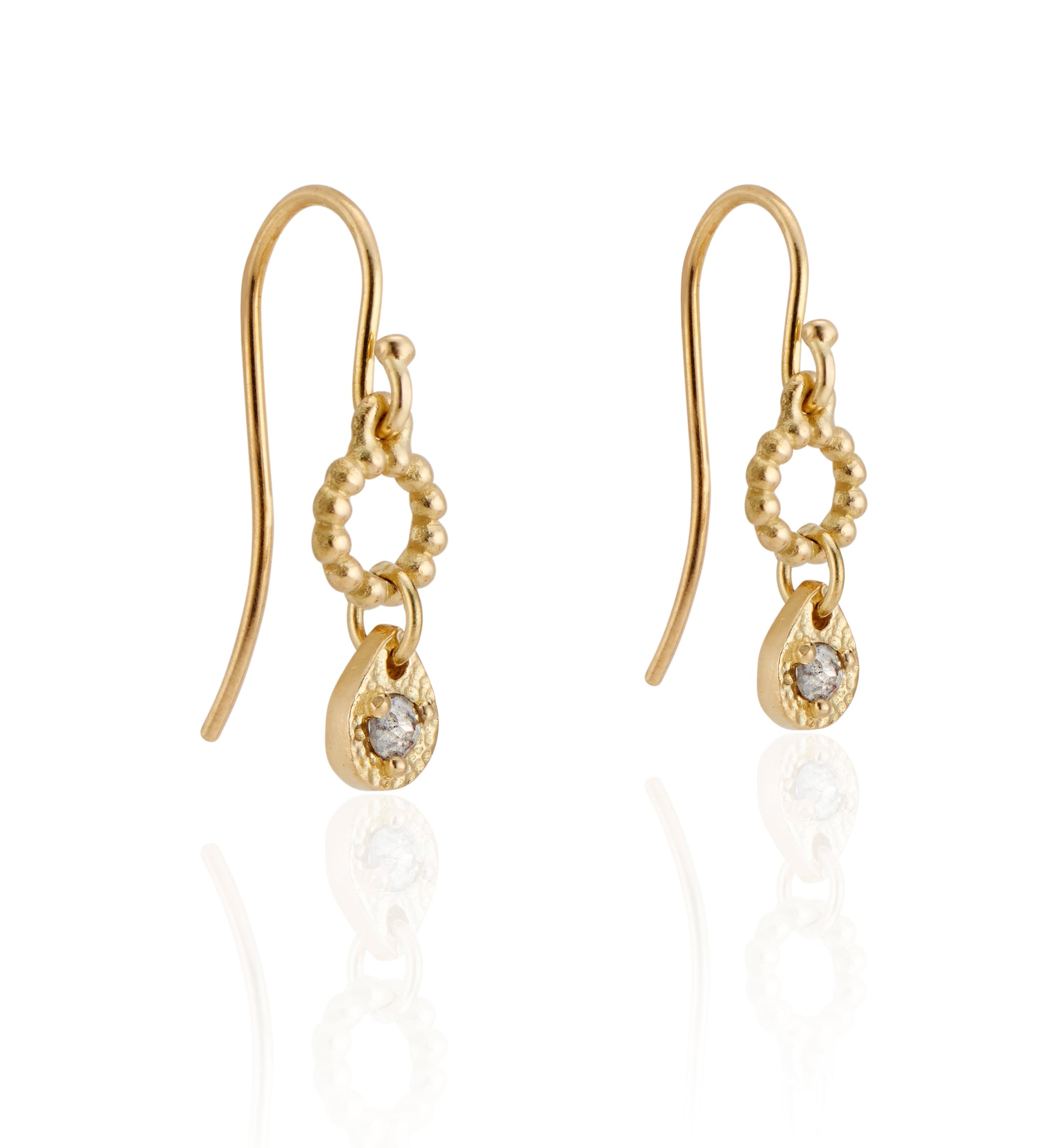 A romantic journey that transcends time. The Drop earring merges a circle of understated gold beads with ornate rose cut diamonds for a dangling romantic style that feels as at home today as it does in an antique jewelry box.