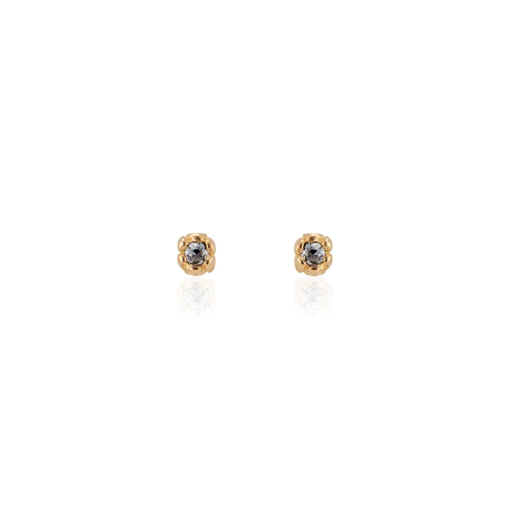 Inspired by a set of rings purchased for a childhood crush, the Bey earrings merge the simplicity of days past with a refined sophistication. Hand-crafted gold petals form a cocoon around a stunning rose cut diamond, creating delicate earrings perfect for celebrating the everyday.