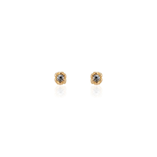 Inspired by a set of rings purchased for a childhood crush, the Bey earrings merge the simplicity of days past with a refined sophistication. Hand-crafted gold petals form a cocoon around a stunning rose cut diamond, creating delicate earrings perfect for celebrating the everyday.