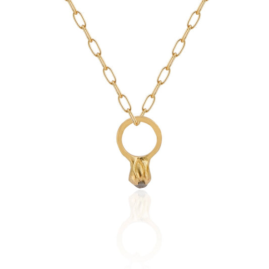 Inspired by a set of rings purchased for a childhood crush, the Bitty Diamond Ring necklace features a delicate gold ring-shaped pendant, hand-crafted with intricate detail to reveal a stunning diamond crown. Perfect for celebrating new motherhood, sisterhood, friendship or love in bloom, the Bitty captures the magic of innocent childhood days, infused now with refined sophistication.