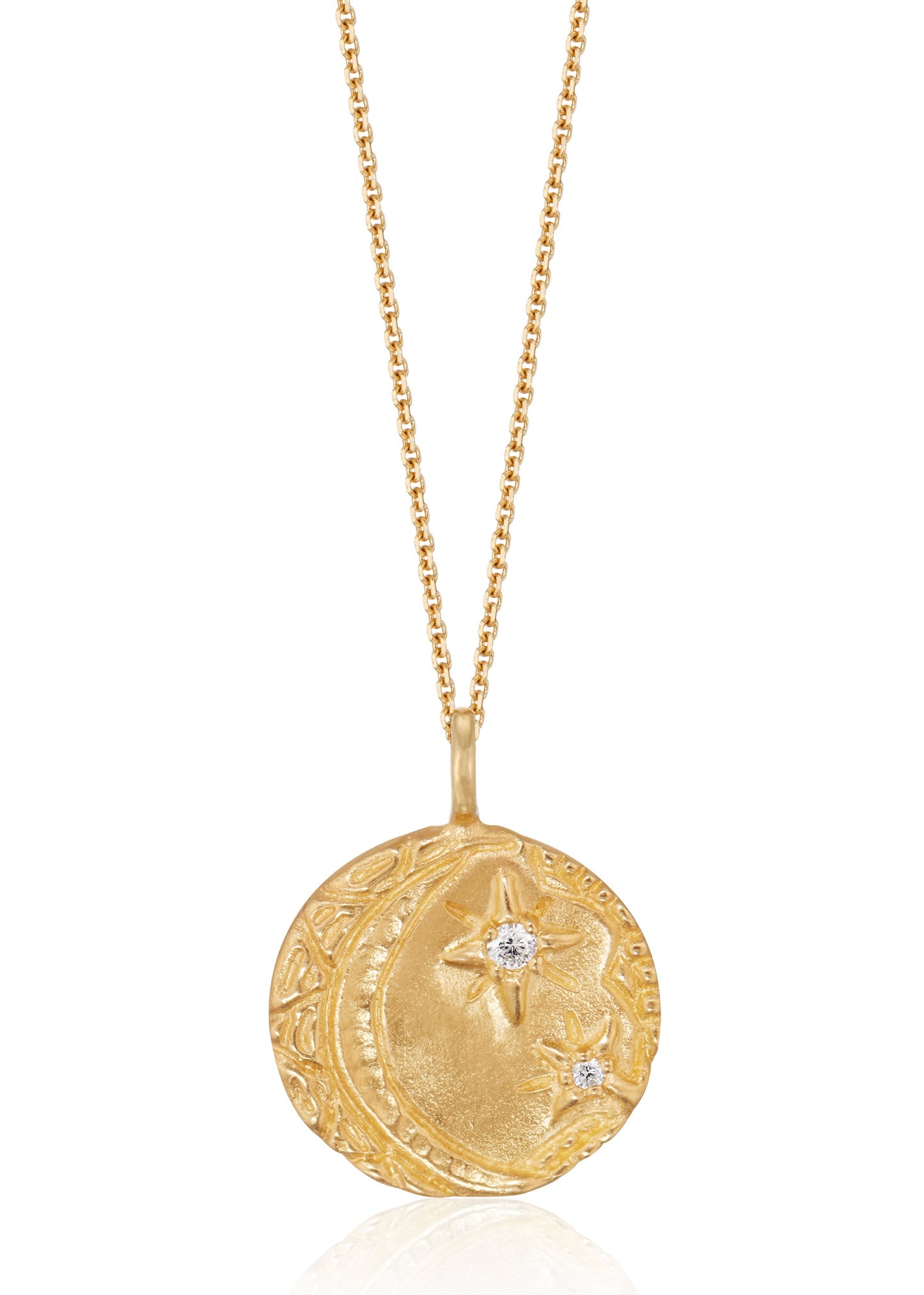 Cheers to the night owls. To the tender souls who create magic in the dark, who carry the secrets of the stars. The Night Owl is a gold pendant necklace that shines with a delicate, hand-textured crescent moon that cradles two diamond stars–an homage to an eternal love that exists beyond boundaries of space and time.