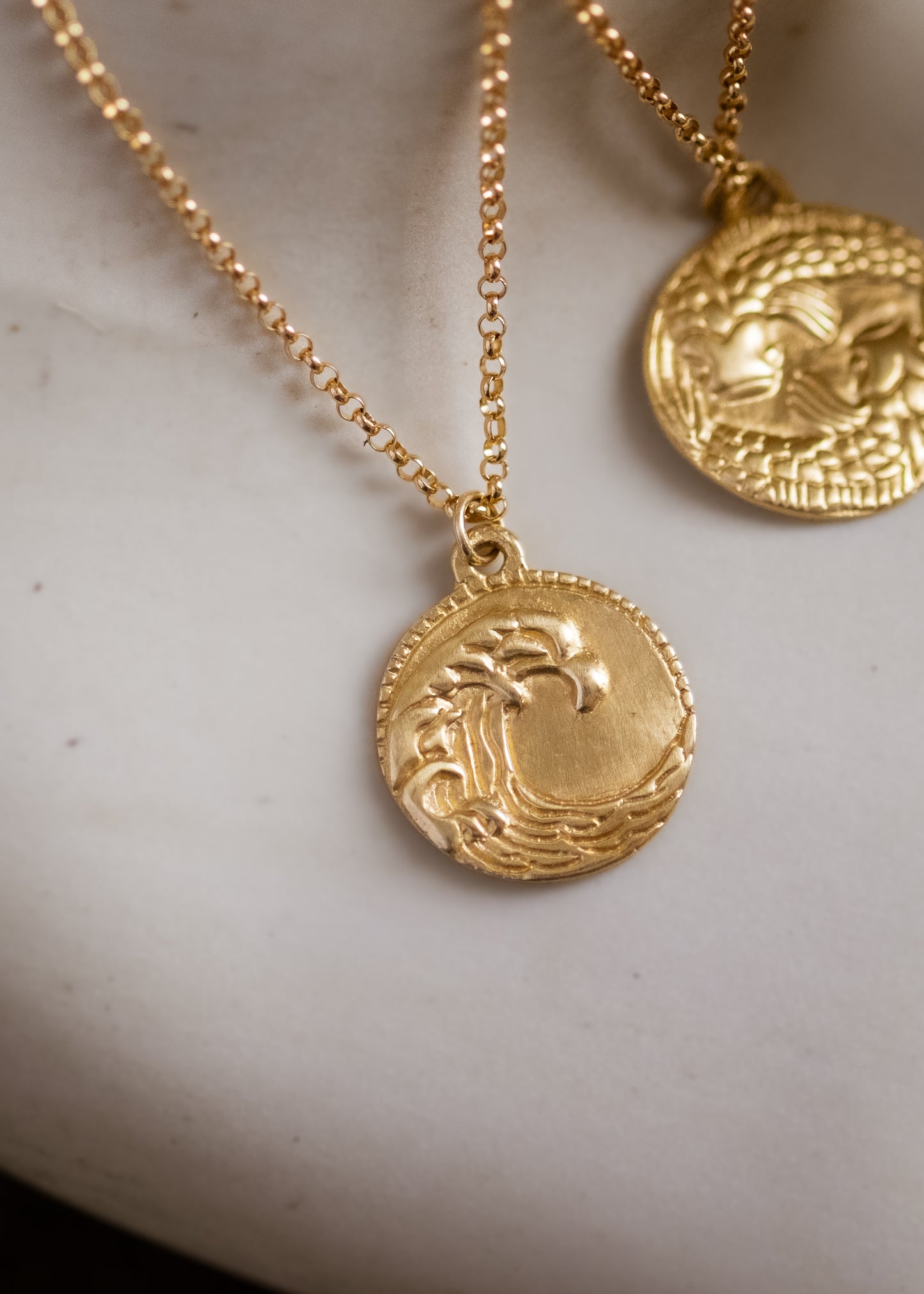 The eleventh sign of the Zodiac, air sign Aquarius is a deep thinker who wants to change the world. A hand-carved wave graces this pendant for a necklace that captures the power of the celestial sky.