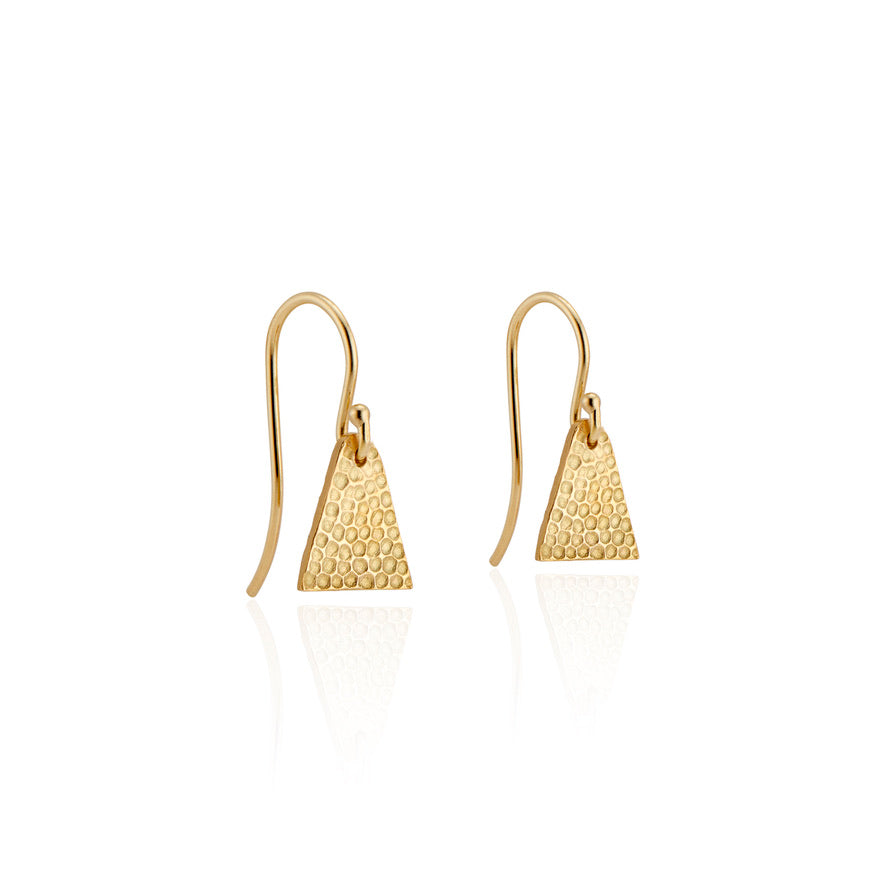 Evocative of the tassel rings worn by a beloved aunt, the triangular shape of the Burr earring represents the strength of the woman who inspired it. An intricate hand-crafted texture plays up the light with each turn of the head.