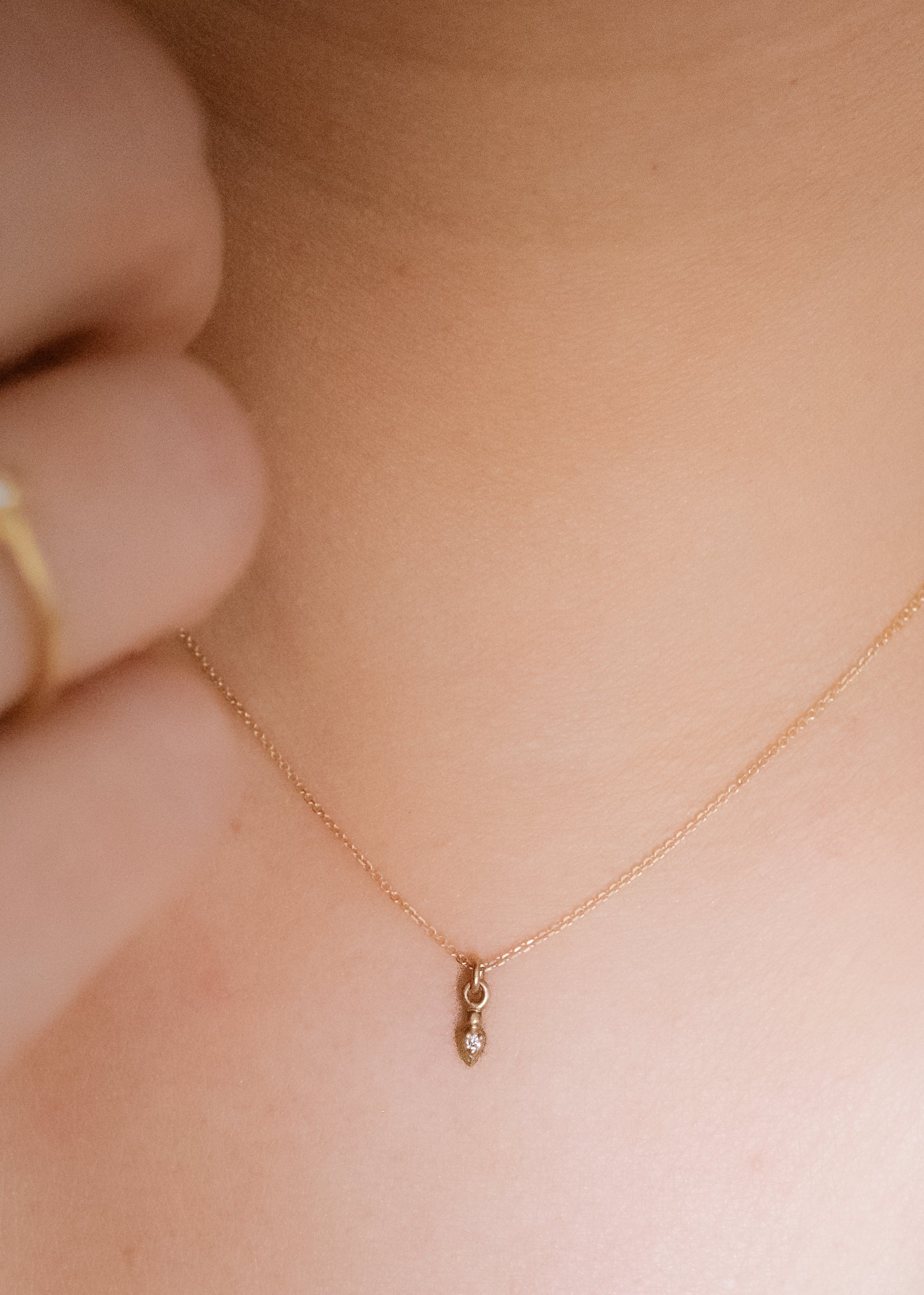 In the City of Lights, the chords of Maxence Cyrin’s piano drift up the alleyway, wrapping around wrought iron balconies and echoing off cobblestone. As timeless as the city itself, the Cyrin necklace drops delicately, revealing a gleaming diamond that sparkles like a reflection off the Seine.