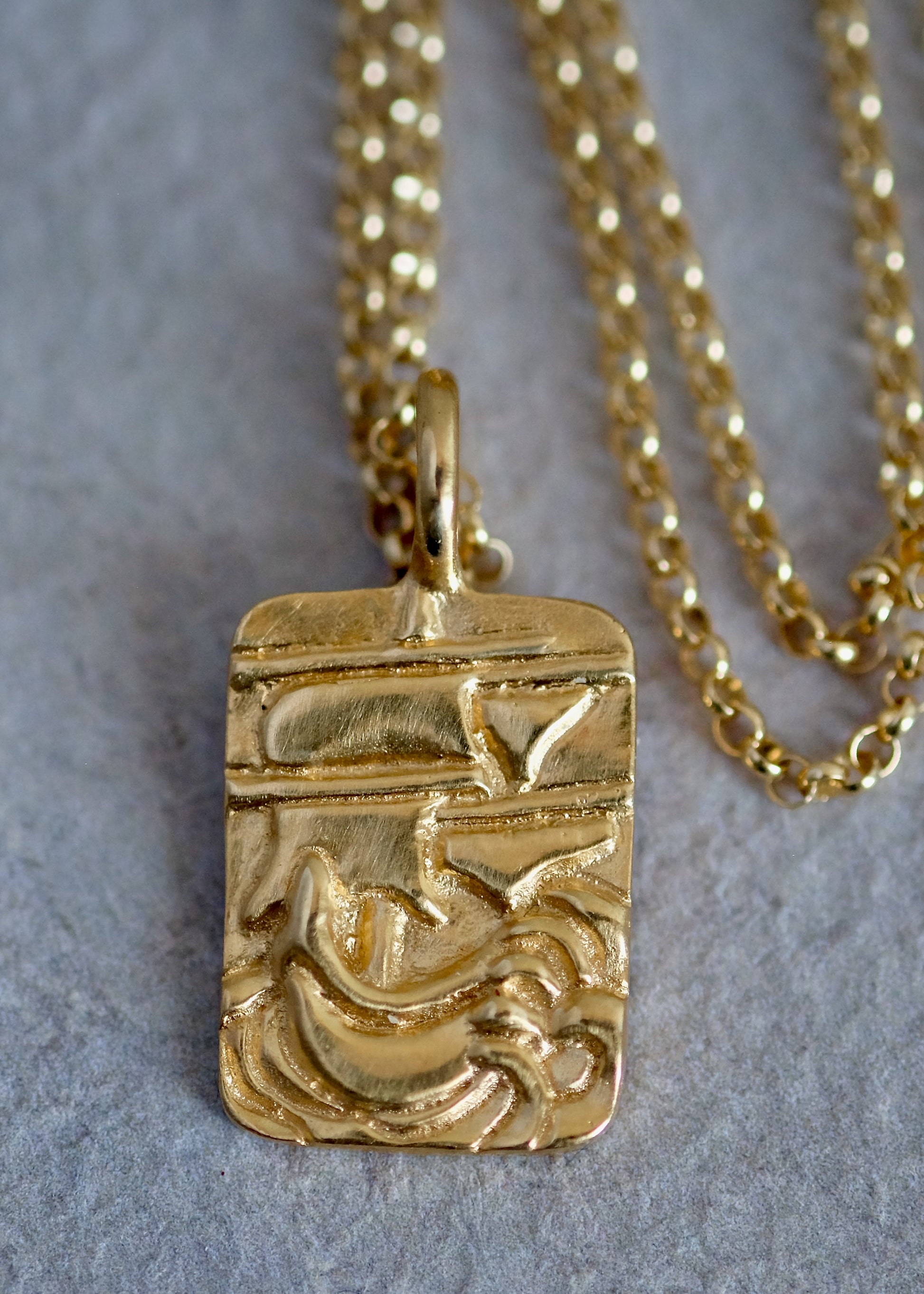 Arising from the swells of a stormy sea, the hand-carved ship of the Phantom necklace graces this substantial rectangular pendant— a timeless piece that echoes the mythic adventures of days past.
