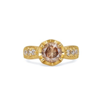 Inspired by the mesmerizing solo by musician Maxence Cyrin, the Gradiva ring embodies both the resonant chords and whimsical trills of the piano in a piece that marries substance with ethereal beauty. Brilliant inlaid diamonds adorn the band of the ring as a precious fancy diamond sits prominently within the gold prongs—an heirloom-worthy ring to be cherished for generations.