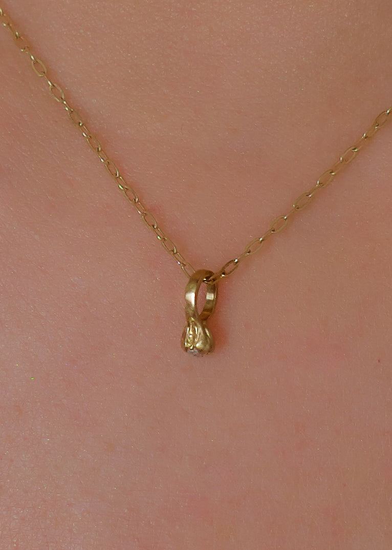 Inspired by a set of rings purchased for a childhood crush, the Bitty Diamond Ring necklace features a delicate gold ring-shaped pendant, hand-crafted with intricate detail to reveal a stunning diamond crown. Perfect for celebrating new motherhood, sisterhood, friendship or love in bloom, the Bitty captures the magic of innocent childhood days, infused now with refined sophistication.