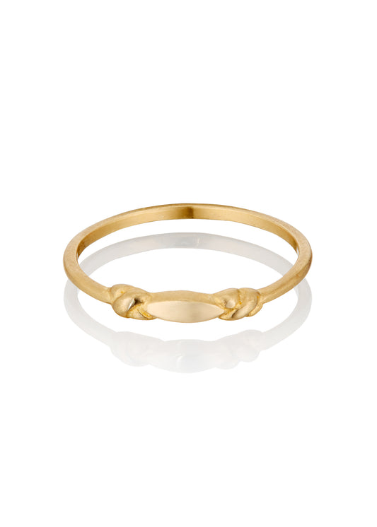 Like a cornice of a treasured landmarked building, the Bond ring features two intricate knots bonded astride a pointed oval–a dainty band ideal for everyday, for wearing solo or layering.