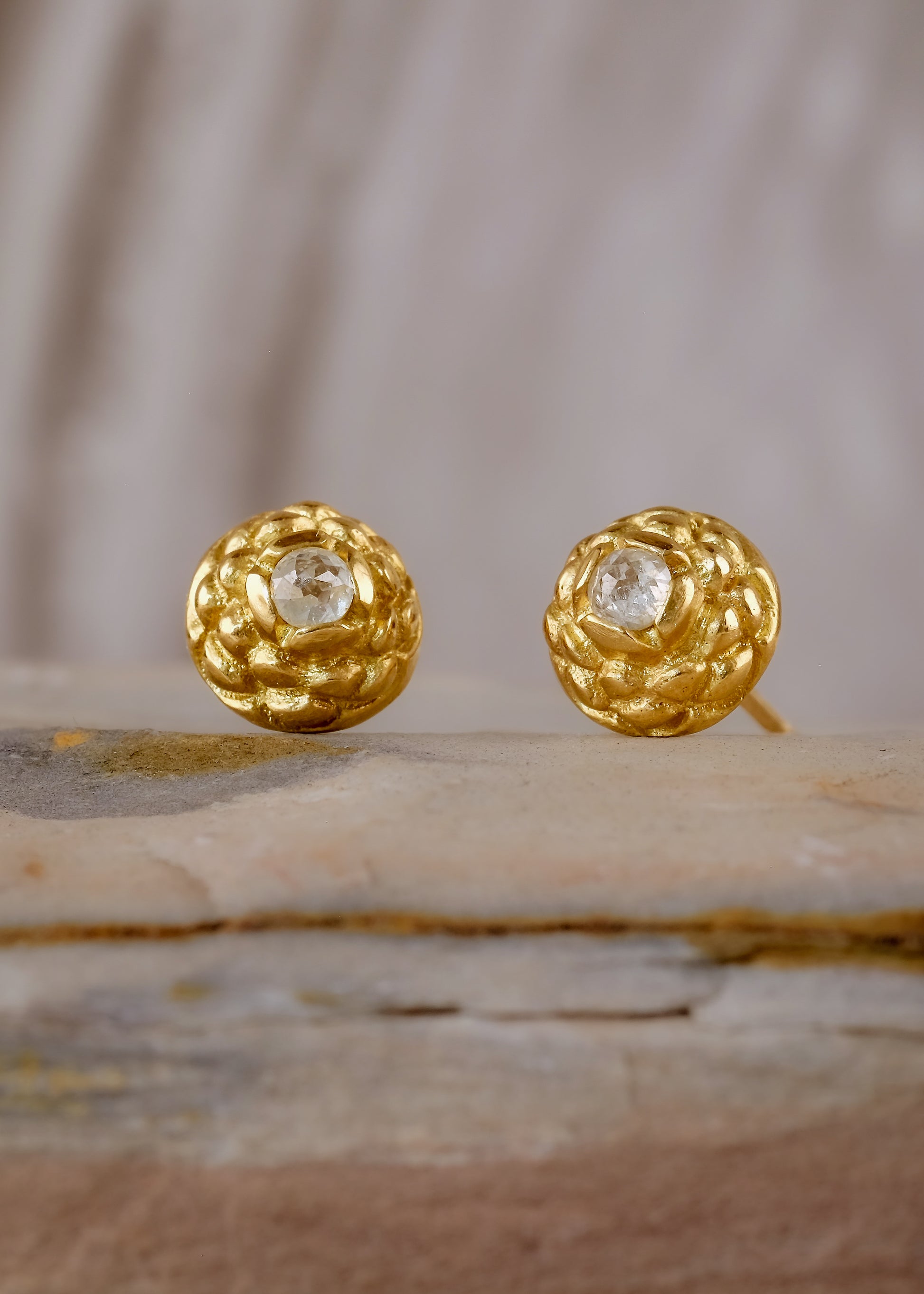 Featuring intricate hand-carved beads that center around brilliant rose cut diamonds, the Marquis earring is fit for royalty and reimagined for everyday wear.