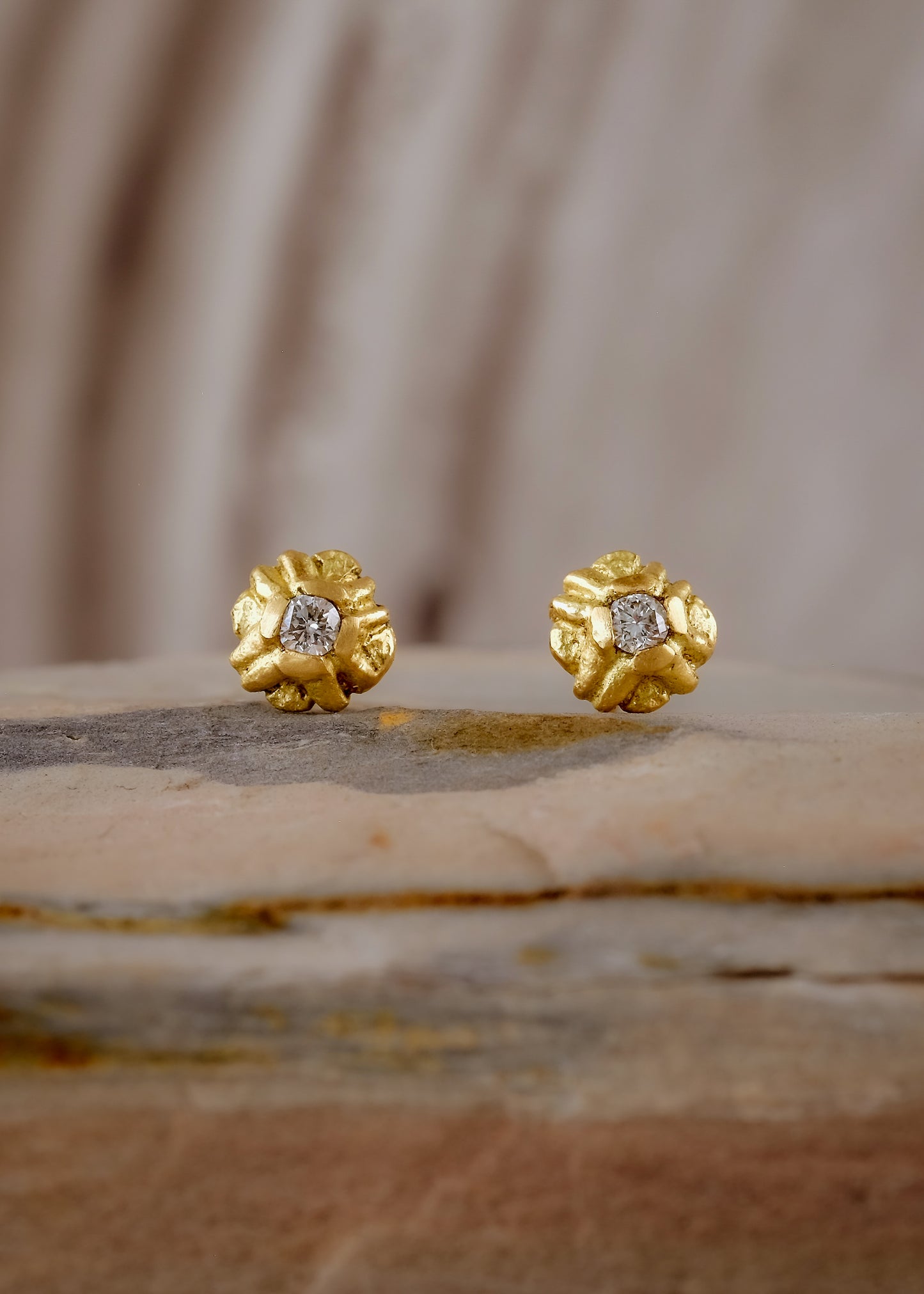 Evocative of a flower turning its face to the last kiss of golden hour sun, the Sorrel earring radiates warmth and botanical beauty. Hand-carved stud earrings are accented with brilliant diamonds, a timeless and romantic style favored for everyday wear.