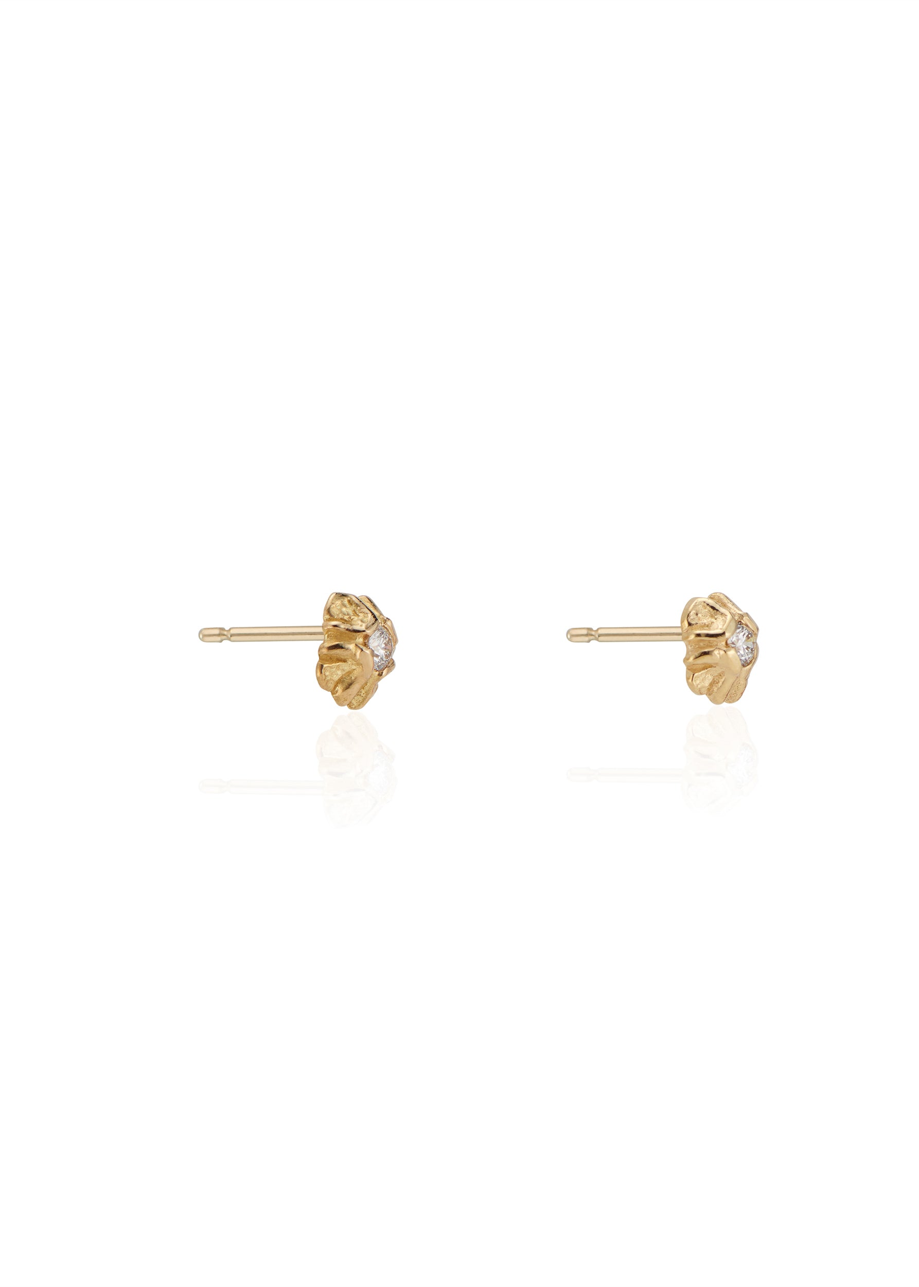 Evocative of a flower turning its face to the last kiss of golden hour sun, the Sorrel earring radiates warmth and botanical beauty. Hand-carved stud earrings are accented with brilliant diamonds, a timeless and romantic style favored for everyday wear.
