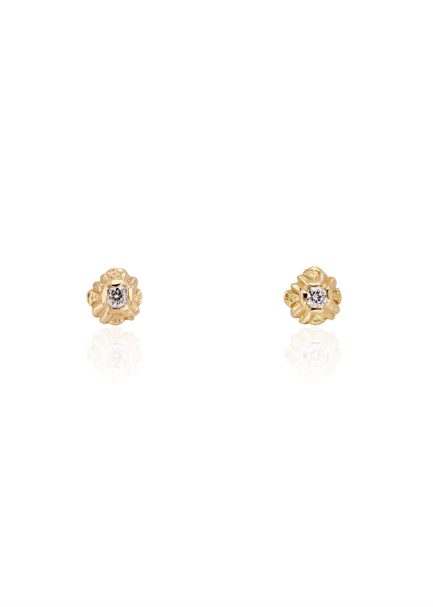 Evocative of a flower turning its face to the last kiss of golden hour sun, the Sorrel earring radiates warmth and botanical beauty. Hand-carved stud earrings are accented with brilliant diamonds, a timeless and romantic style favored for everyday wear.