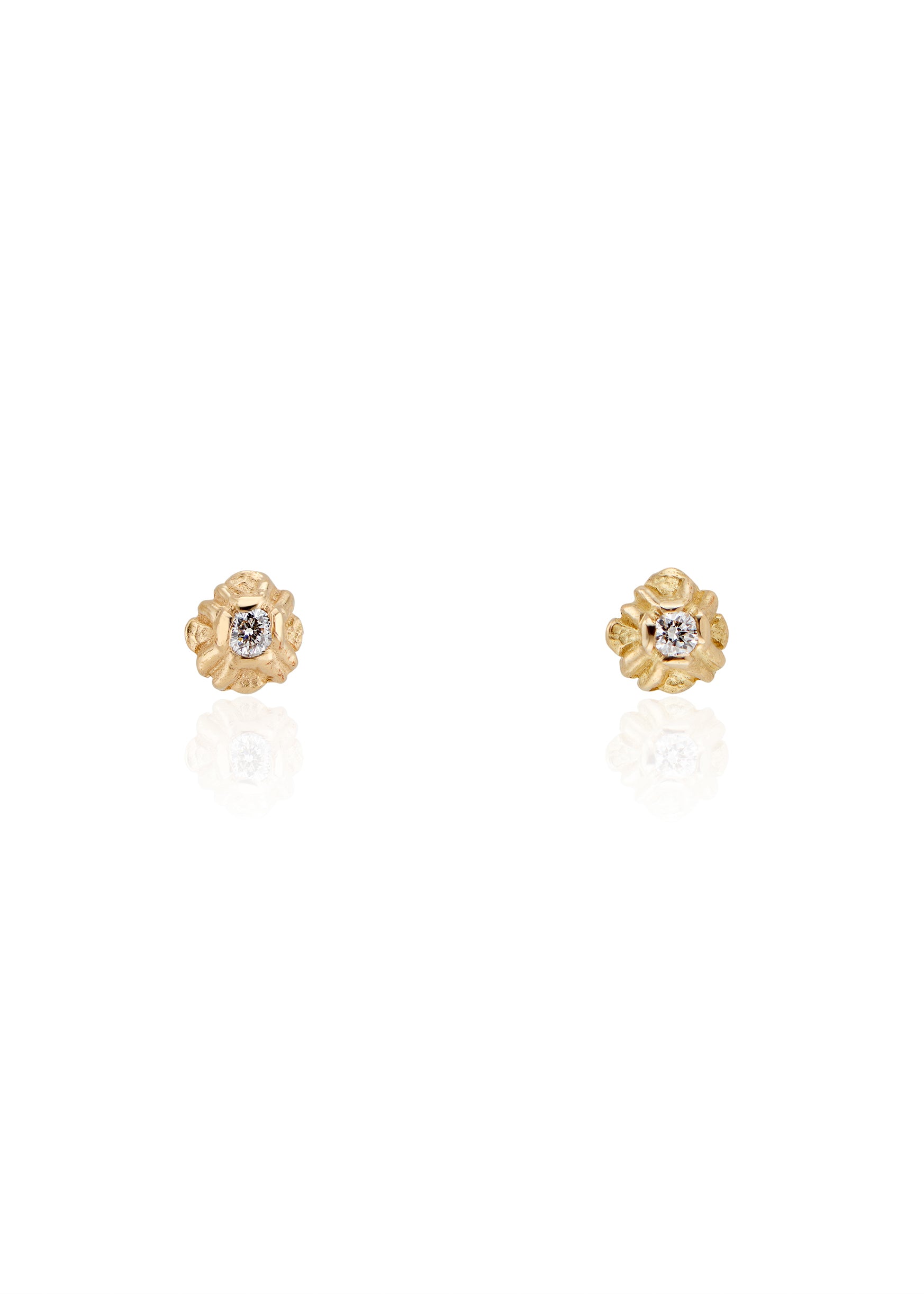 Evocative of a flower turning its face to the last kiss of golden hour sun, the Sorrel earring radiates warmth and botanical beauty. Hand-carved stud earrings are accented with brilliant diamonds, a timeless and romantic style favored for everyday wear.