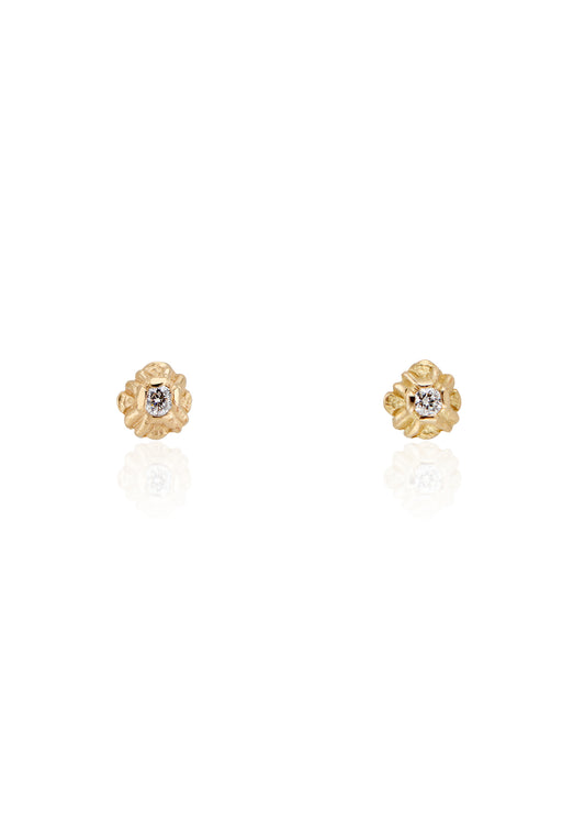 Evocative of a flower turning its face to the last kiss of golden hour sun, the Sorrel earring radiates warmth and botanical beauty. Hand-carved stud earrings are accented with brilliant diamonds, a timeless and romantic style favored for everyday wear.