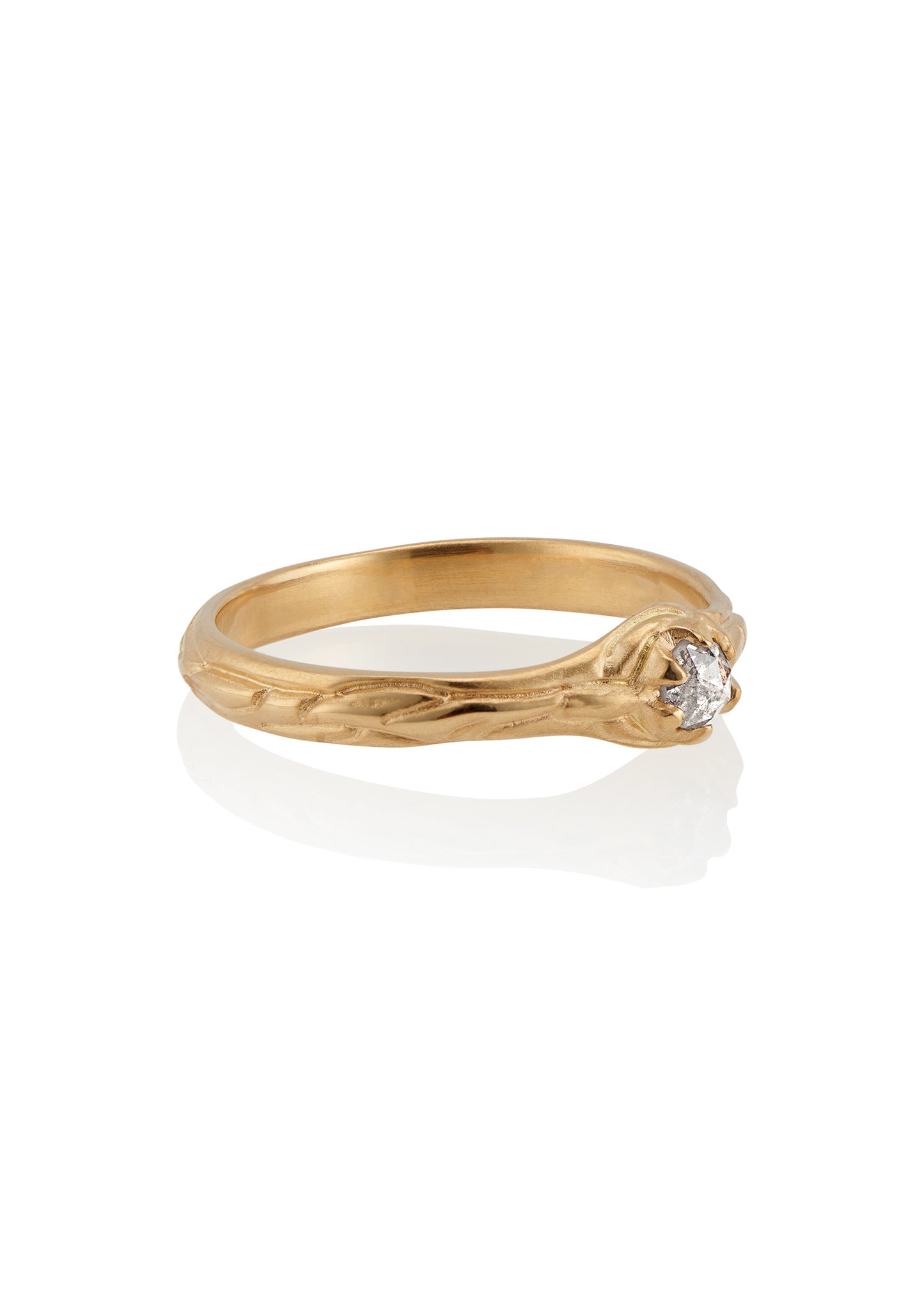 Inspired by the southern constellation, the Ara ring reflects the brilliance of the night sky with a rose cut diamond that sits flush against a hand-carved gold band—a piece as timeless as the stars themselves.