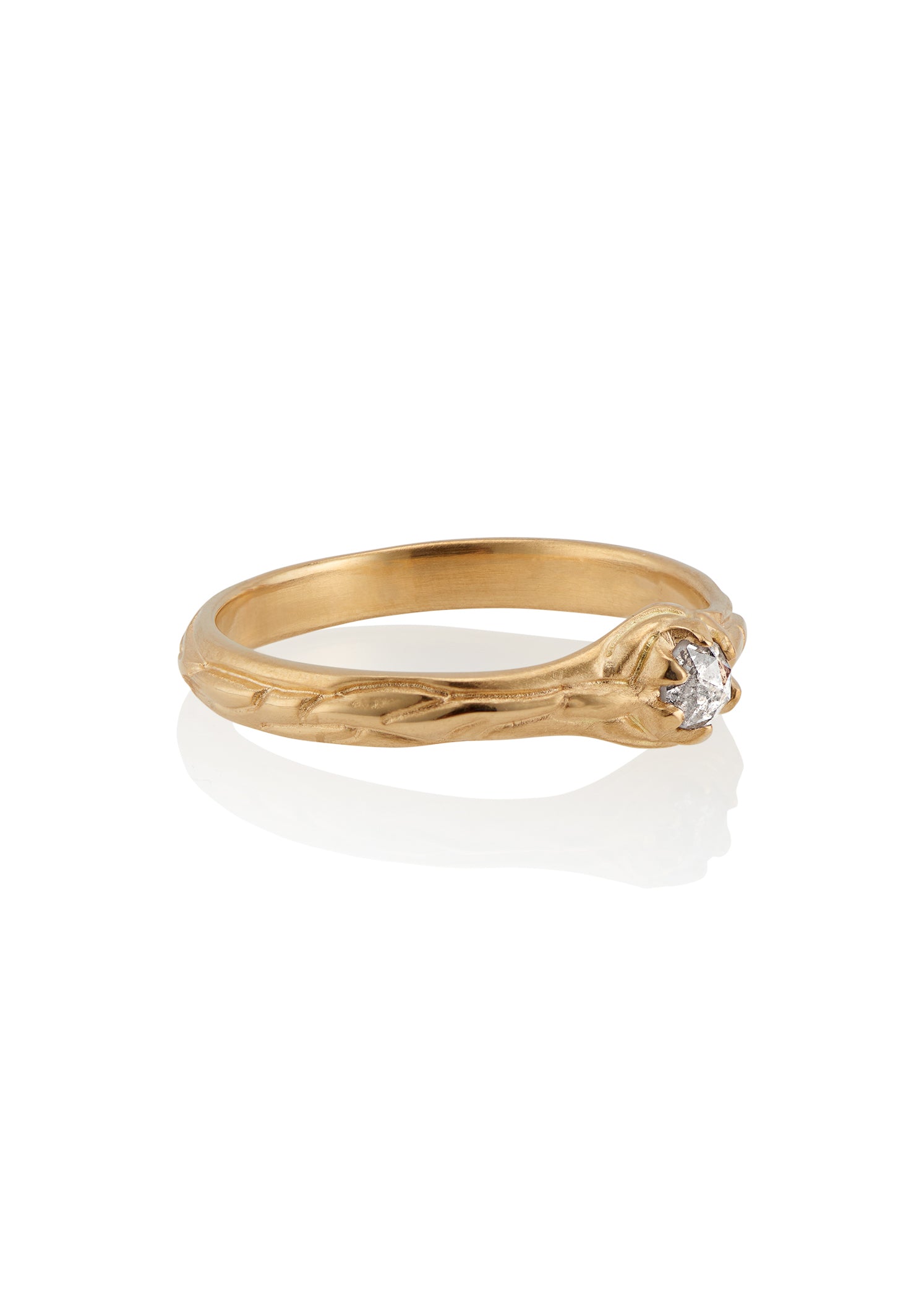 Inspired by the southern constellation, the Ara ring reflects the brilliance of the night sky with a rose cut diamond that sits flush against a hand-carved gold band—a piece as timeless as the stars themselves.