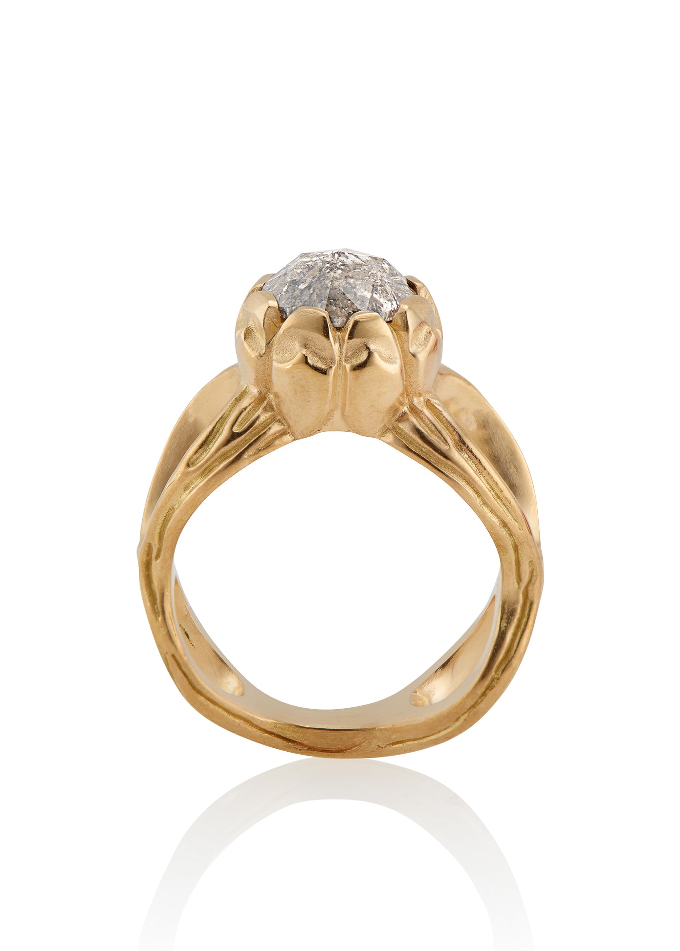 The ring that began a lifelong love affair with rose cut diamonds. With its hand-detailed gold band, the Crown ring sits loftily on the finger, its vertical prongs enveloping a brilliant rose cut diamond—truly, a piece that reigns supreme.