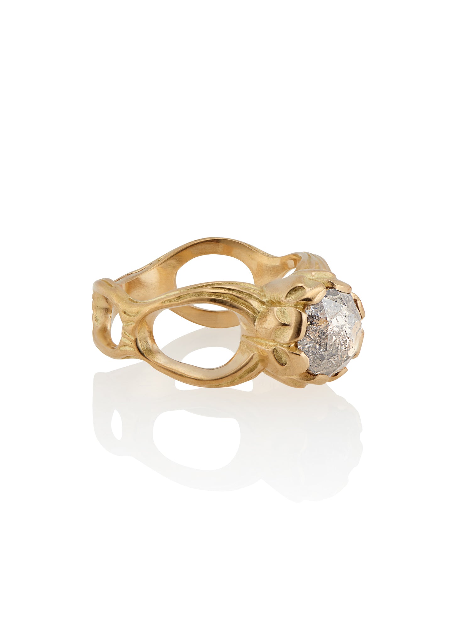 The ring that began a lifelong love affair with rose cut diamonds. With its hand-detailed gold band, the Crown ring sits loftily on the finger, its vertical prongs enveloping a brilliant rose cut diamond—truly, a piece that reigns supreme.