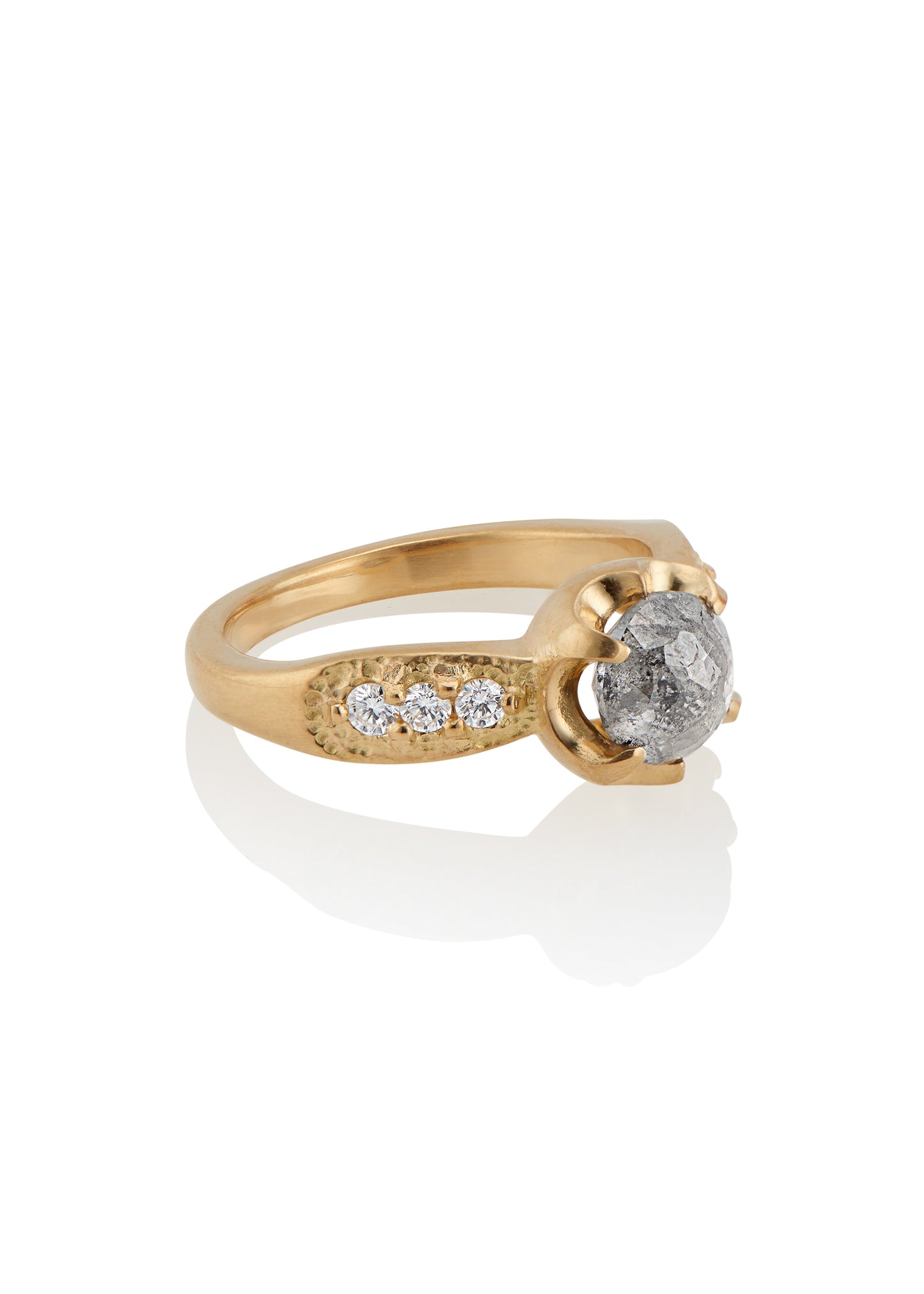 Inspired by the mesmerizing solo by musician Maxence Cyrin, the Gradiva ring embodies both the resonant chords and whimsical trills of the piano in a piece that marries substance with ethereal beauty. Brilliant inlaid diamonds adorn the band of the ring as a precious rose cut diamond sits prominently within the gold prongs—an heirloom-worthy ring to be cherished for generations.