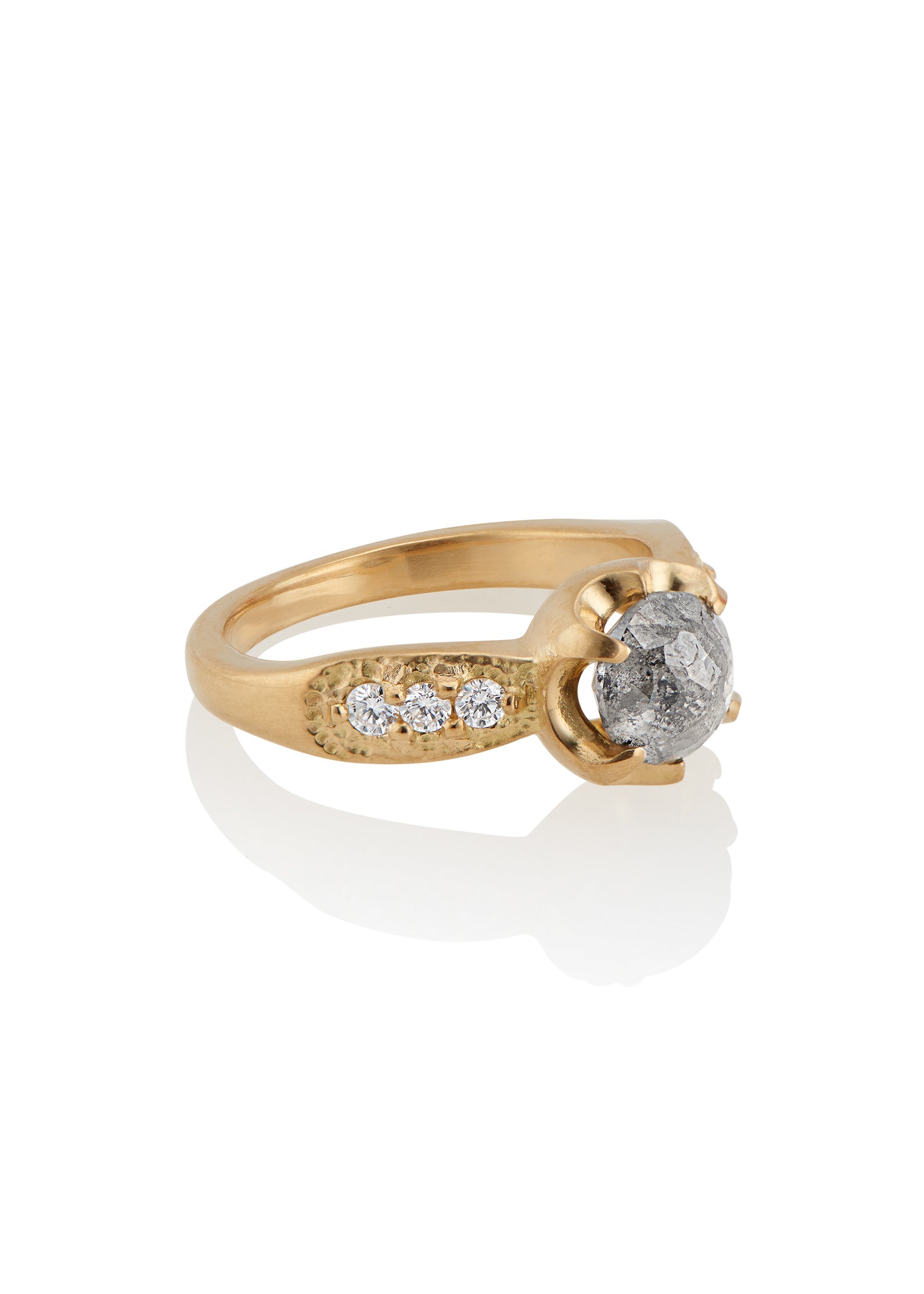 Inspired by the mesmerizing solo by musician Maxence Cyrin, the Gradiva ring embodies both the resonant chords and whimsical trills of the piano in a piece that marries substance with ethereal beauty. Brilliant inlaid diamonds adorn the band of the ring as a precious rose cut diamond sits prominently within the gold prongs—an heirloom-worthy ring to be cherished for generations.