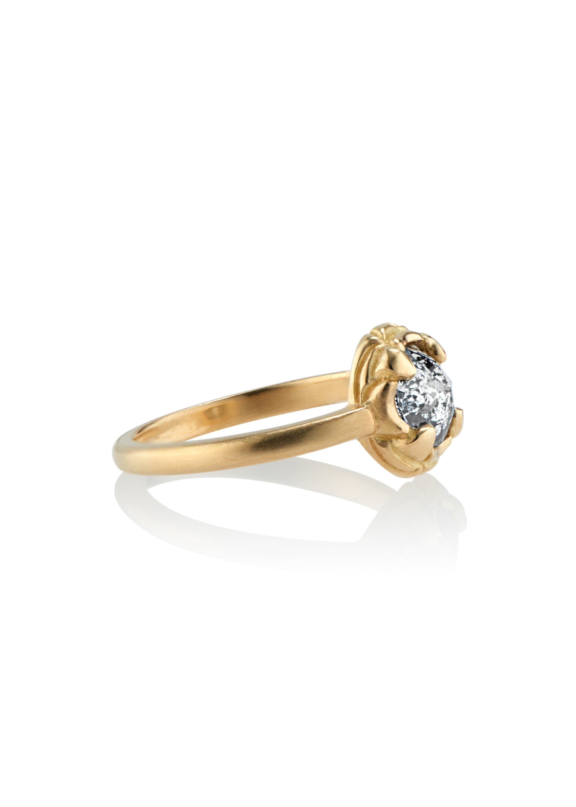 Named for Empress Josephine, this ring pairs perfectly with the Empress nesting band. Still stunning on its own, this ring features a rose cut diamond set securely within four prongs— a minimalist setting that marries a modern aesthetic with echoes of the past.