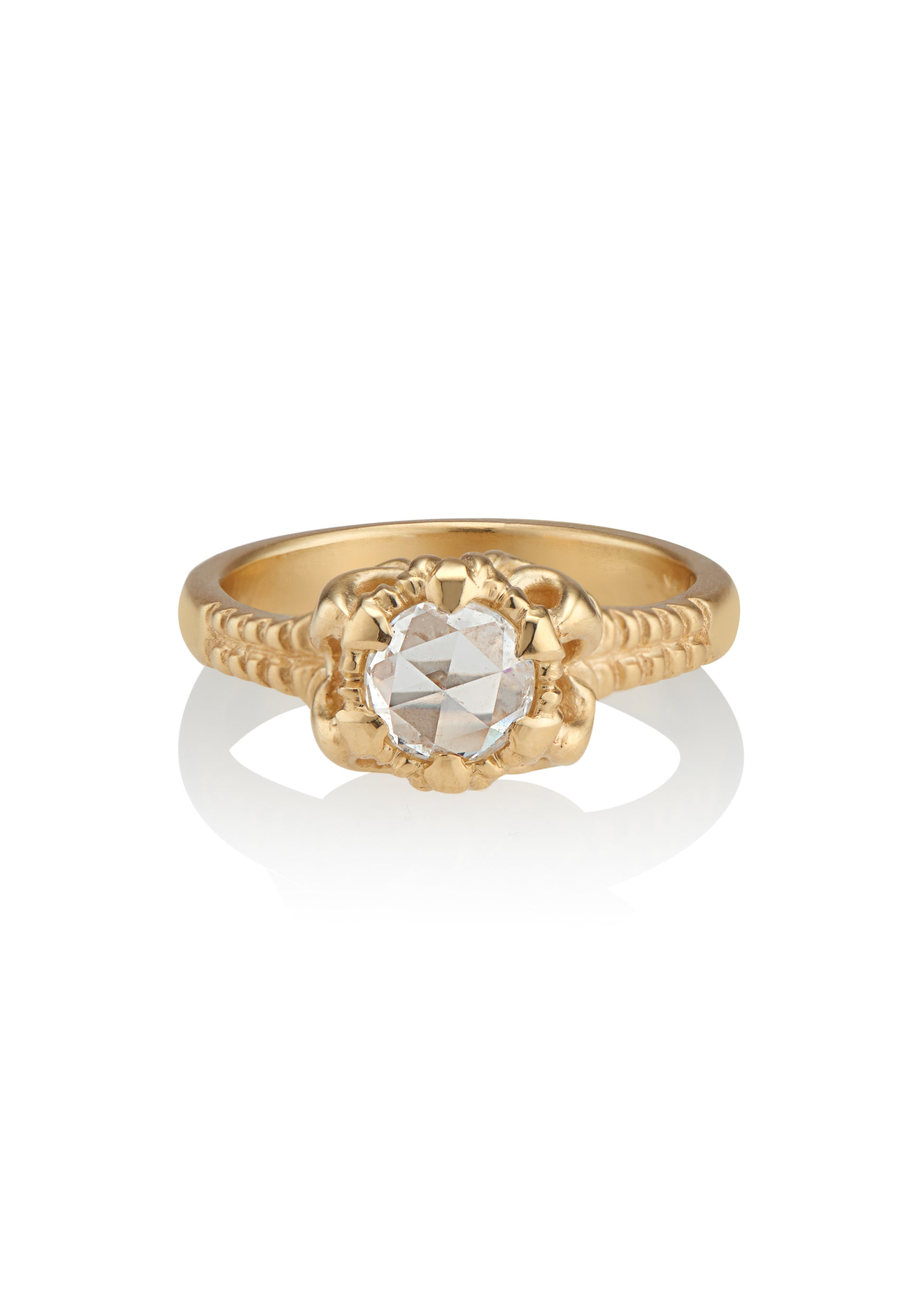 A mythical creature who continues to captivate the imagination, Lilith’s hair was referred to by the poet Rosetti as “the first gold.” A gleaming rose cut diamond is set among an intricately detailed gold band—an homage to Lilith’s ability to cast her spell wherever she goes.