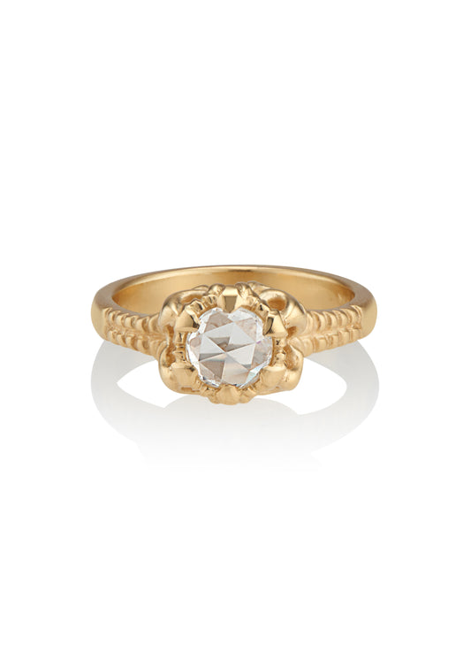 A mythical creature who continues to captivate the imagination, Lilith’s hair was referred to by the poet Rosetti as “the first gold.” A gleaming rose cut diamond is set among an intricately detailed gold band—an homage to Lilith’s ability to cast her spell wherever she goes.