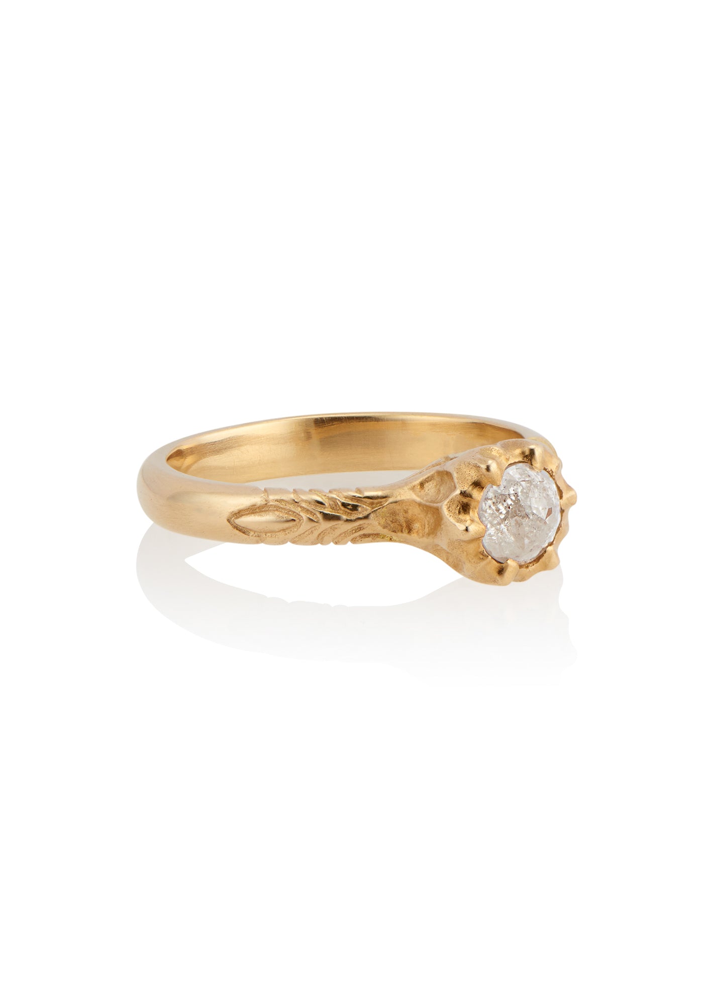 Like the haunting notes of a Glenn Miller Orchestra record, the Perfidia ring ascends to prominence on the finger to captivate all who bear witness to such beauty. Delicate details on the gold band give way to a textured pattern that holds a rose cut diamond, an exquisite work of ornate craftsmanship.