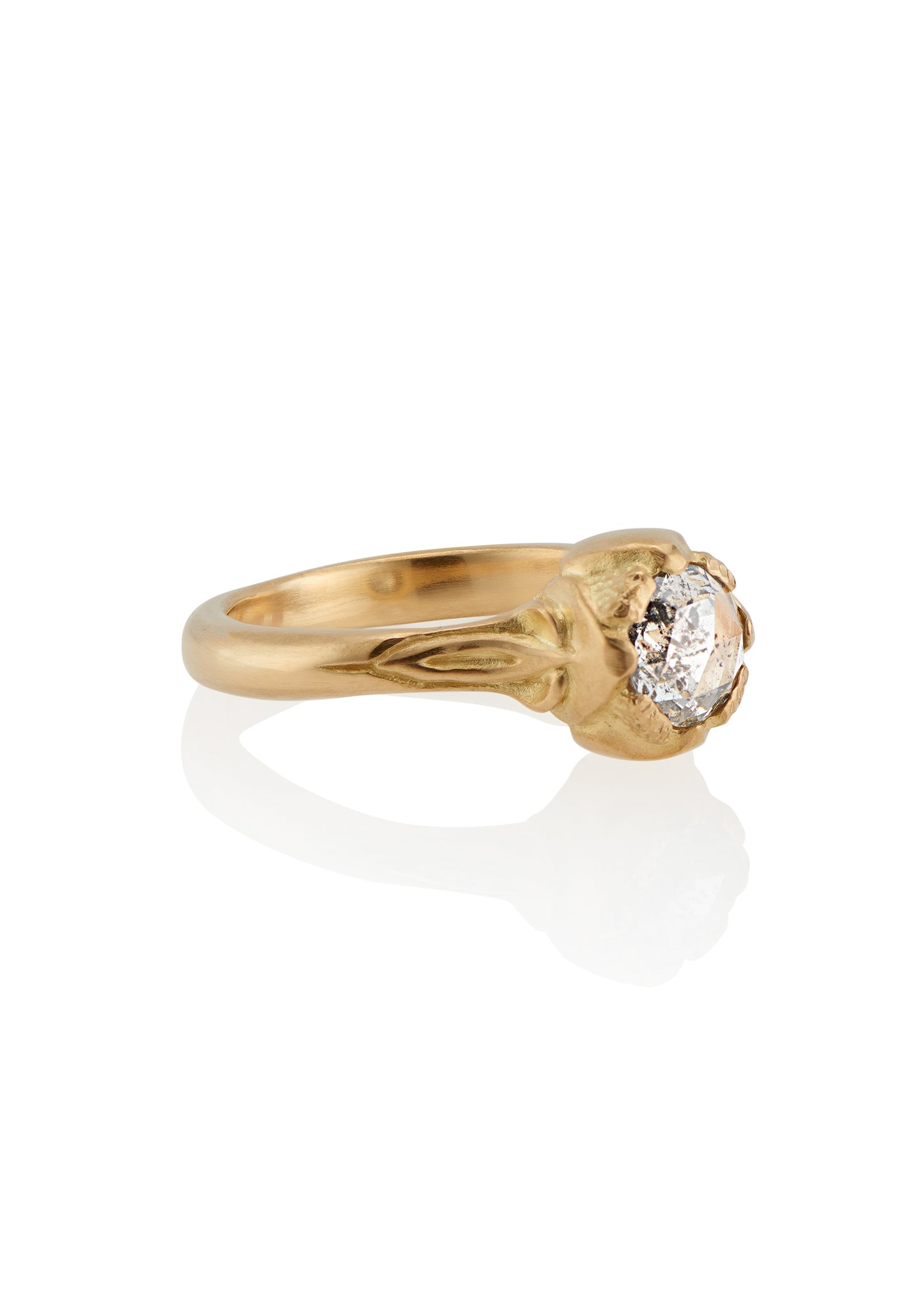 Taking its cue from nature, the Sepal ring captures the intricacy of layered flower petals rendered in gold, revealing a precious rose cut diamond—a refined piece that’s as timeless and beautiful as the botanical world.