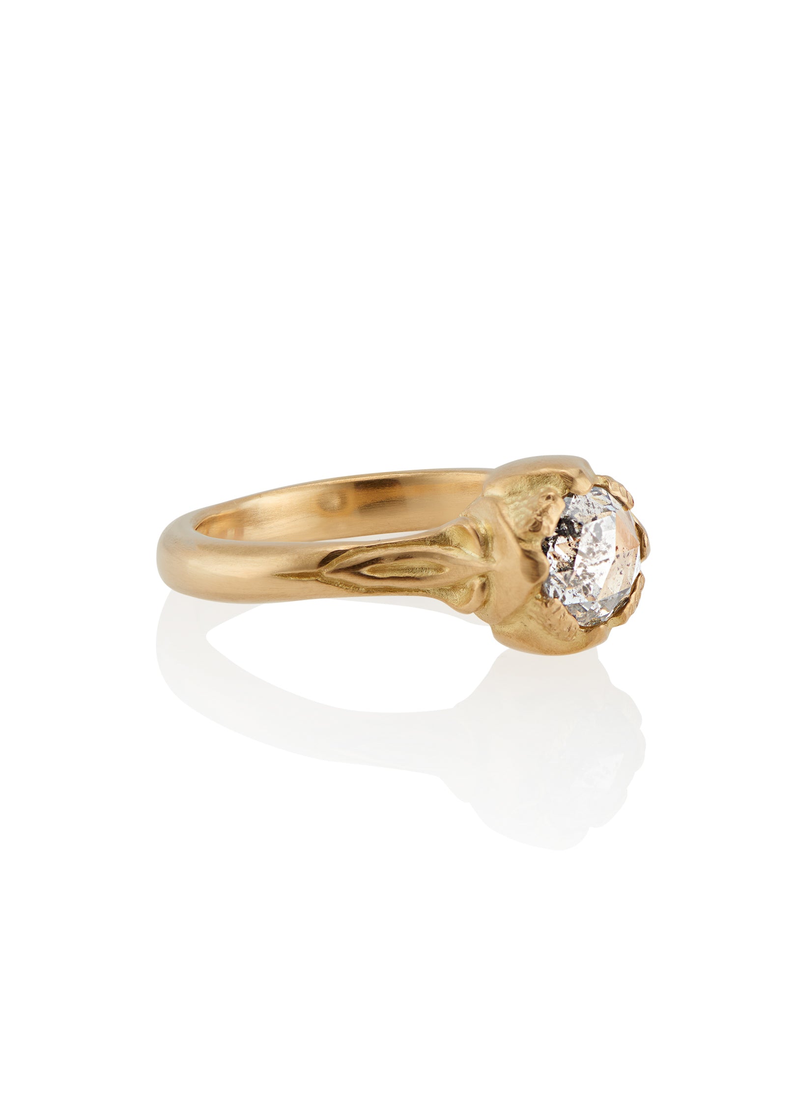Taking its cue from nature, the Sepal ring captures the intricacy of layered flower petals rendered in gold, revealing a precious rose cut diamond—a refined piece that’s as timeless and beautiful as the botanical world.