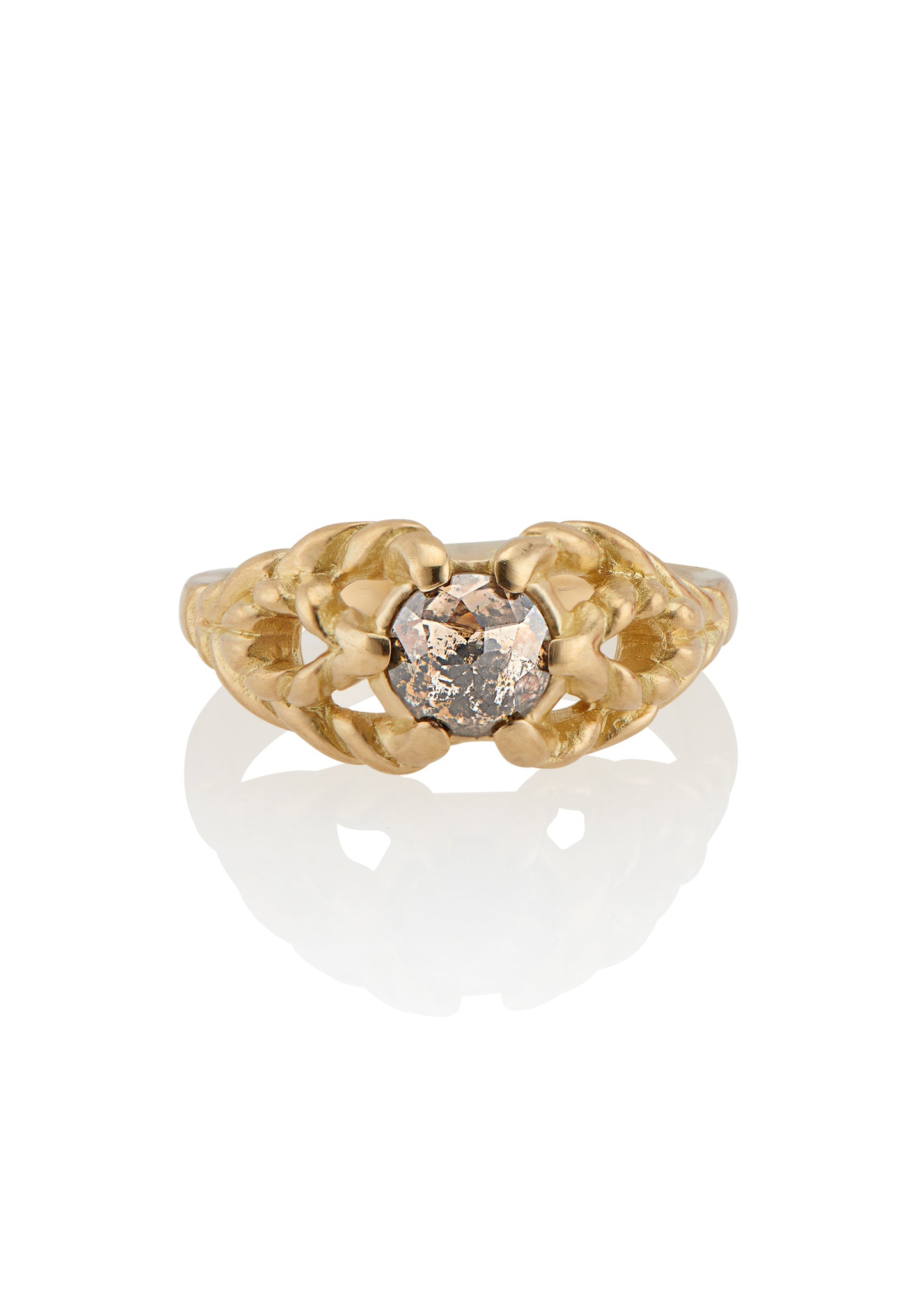 Featuring hand-carved gold that twists and turns to create a rope-like look, the Twine ring holds a stunning rose cut diamond— a piece that embodies strength, grace and beauty.