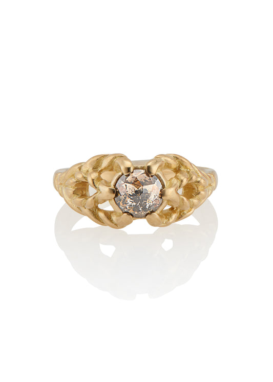 Featuring hand-carved gold that twists and turns to create a rope-like look, the Twine ring holds a stunning rose cut diamond— a piece that embodies strength, grace and beauty.