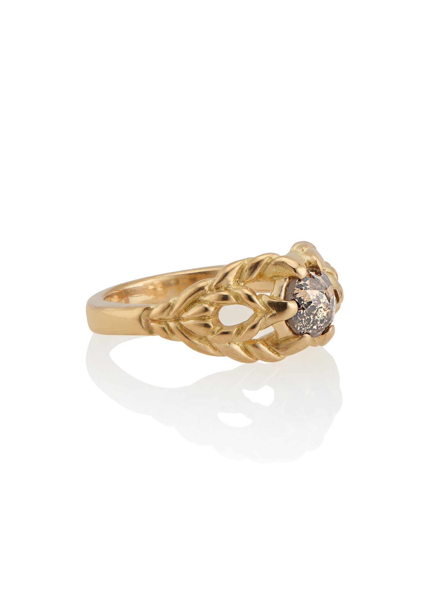 Featuring hand-carved gold that twists and turns to create a rope-like look, the Twine ring holds a stunning rose cut diamond— a piece that embodies strength, grace and beauty.