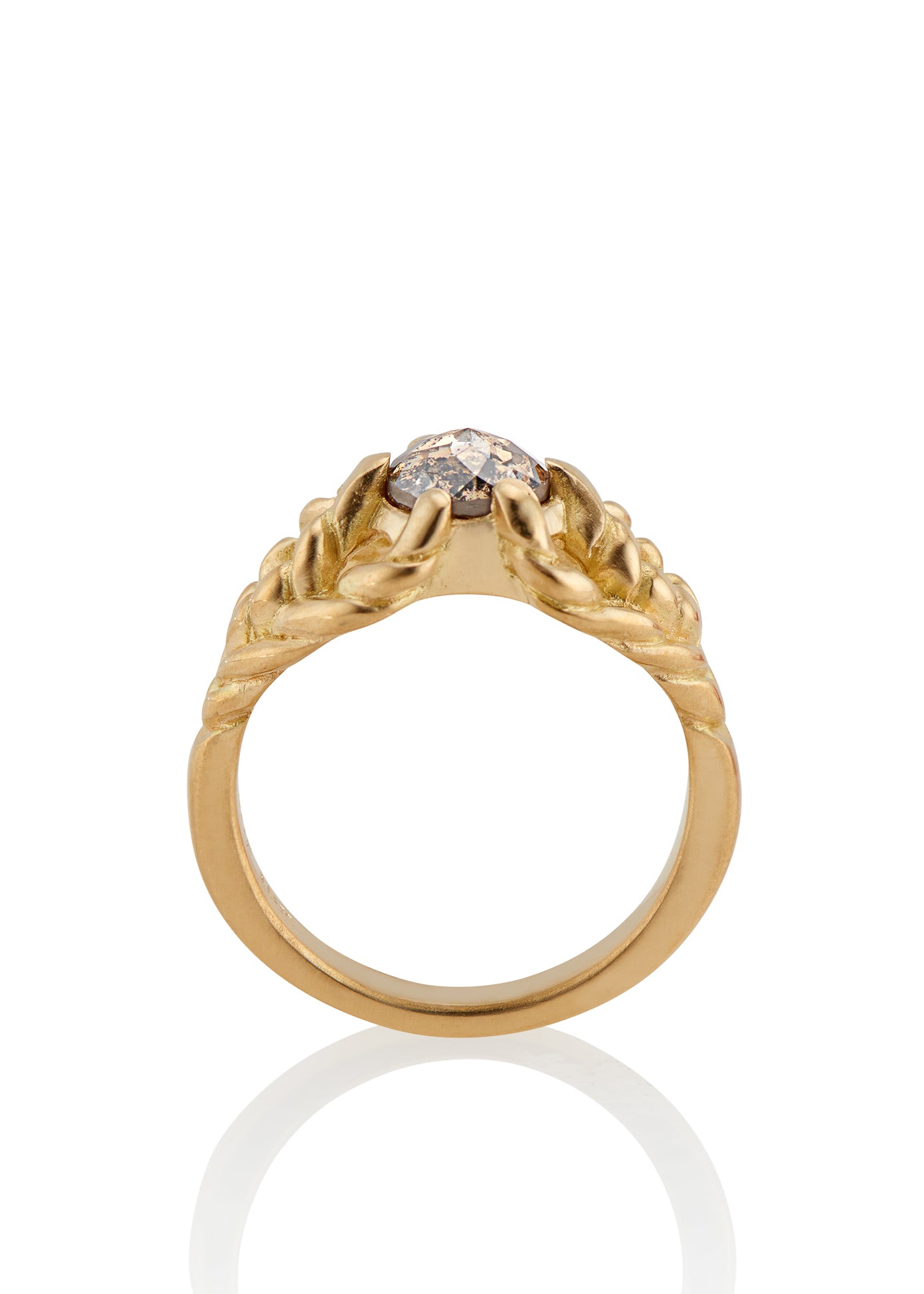 Featuring hand-carved gold that twists and turns to create a rope-like look, the Twine ring holds a stunning rose cut diamond— a piece that embodies strength, grace and beauty.