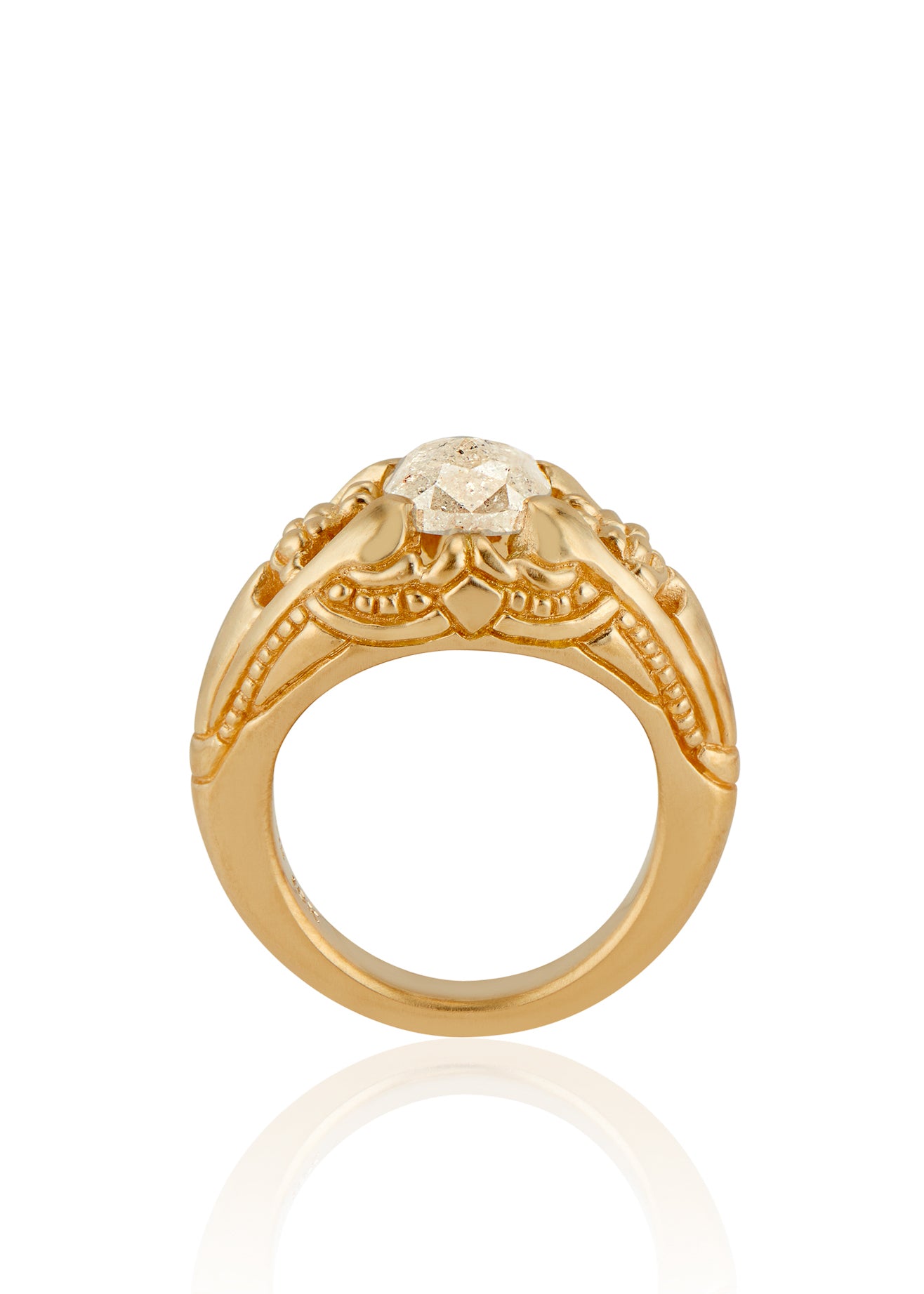 Capturing the ornate details of the Victorian era, the Violette ring was inspired by the love between Prince Albert and Queen Victoria. A substantial gold band is rich in intricate detail, showcasing craftsmanship with each bead, curve and open space. A stunning rose cut diamond sits flush among the prongs, creating a romantic ring to cherish for the ages.