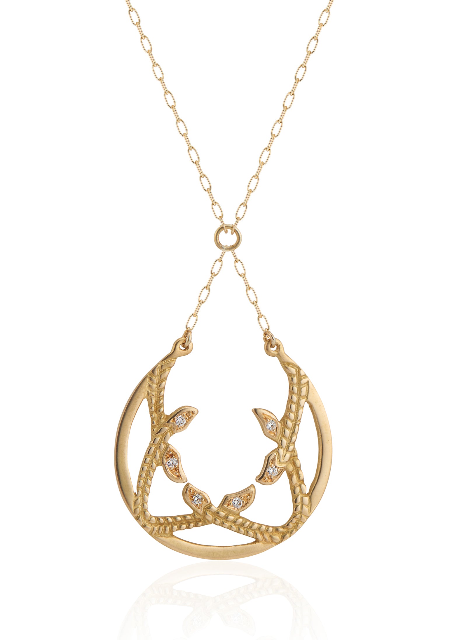 Inspired by the female prophets who share its name, the Sibyl necklace whispers the mysteries of the future while echoing stories of days past. Smooth open-work crescents give way to intertwining textured elements, hand-carved to draw the eye in and reveal brilliant diamond accents—a substantial and haunting design that’s decidedly feminine.