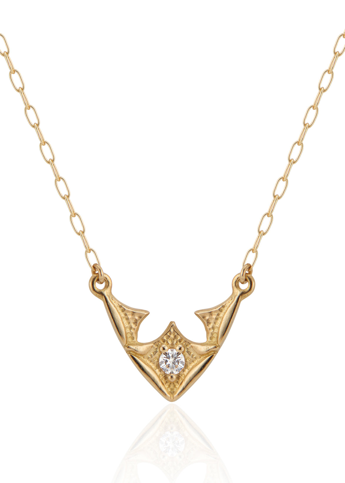 Taken from the French word for “vault,” the Volta necklace is an homage to the Gothic architecture of Paris. Gentle sloping curves give way to acute points, evoking the grandeur of a centuries-old cathedral ceiling. A single diamond catches the eye, complemented by ornate texture and delicate beading—a necklace that transcends time and transports the imagination.