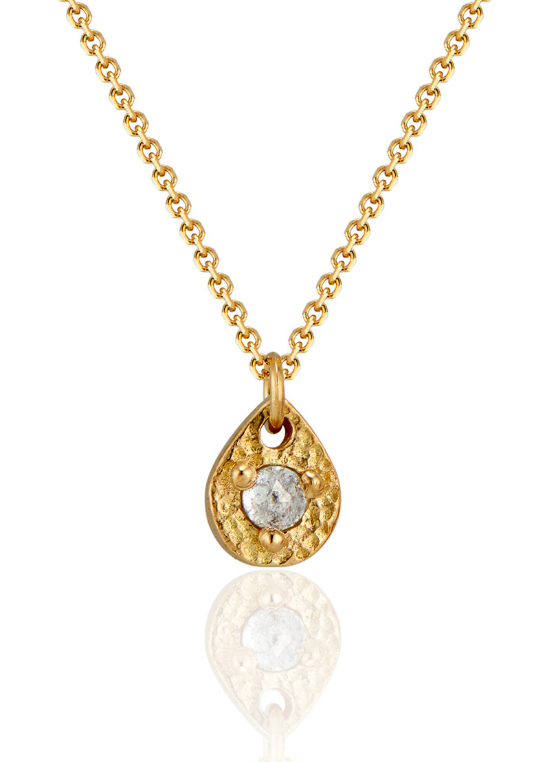 A romantic journey that transcends time. The Drop necklace merges a circle of understated hand-carved gold beads with ornate rose cut diamonds for a dangling romantic style that feels as at home today as it does in an antique jewelry box.