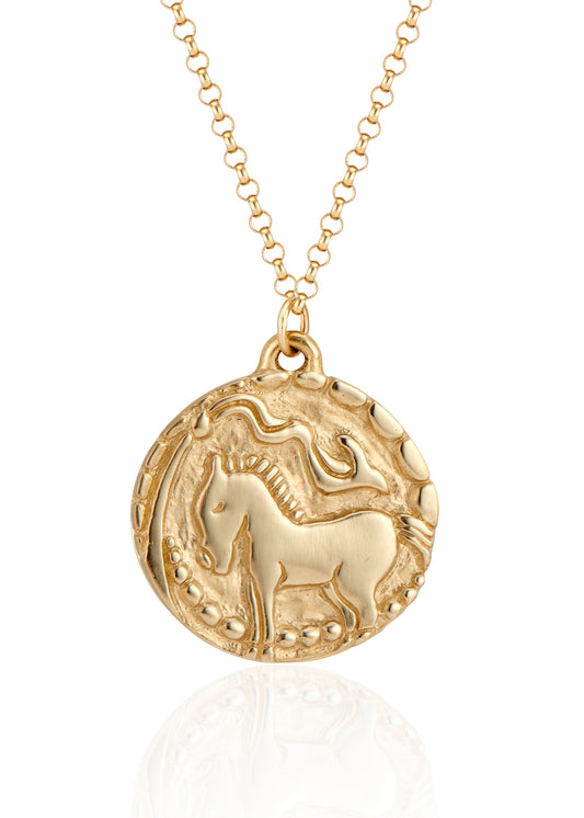 With its hand-carved horse—an embodiment of beauty and strength— and intricate detail, the Coronation necklace marries the artistry of metalwork with a spirit of whimsy and independence. A powerful totem of personal sovereignty.