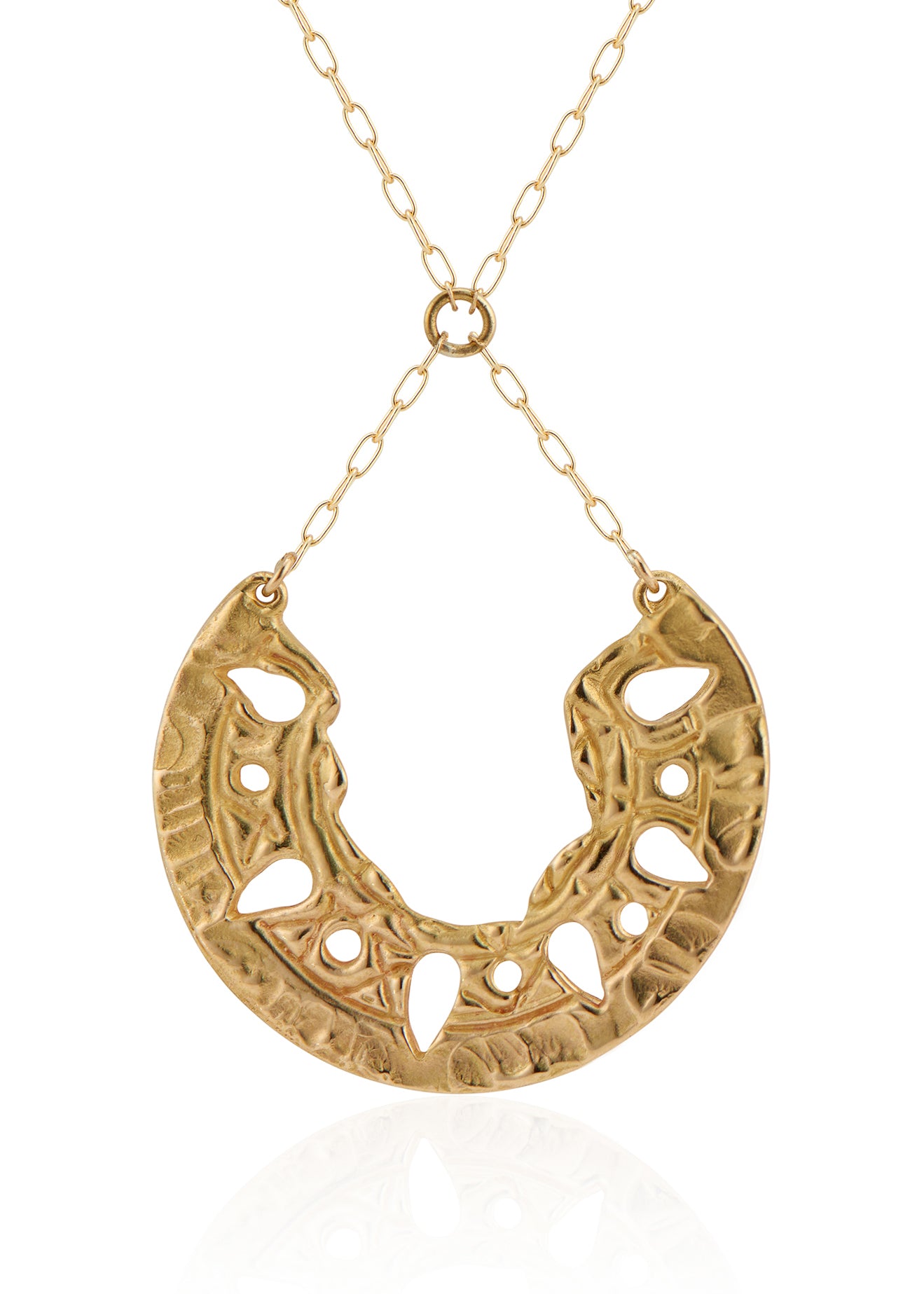 Sun-scorched sand. Glyphs that whisper centuries-old spells. Calling to mind the revered wesekh collars of ancient Egypt, the Demi necklace gleams in a crescent of textured gold. Punctuated with an arresting open-work pattern done by hand, this is a piece that harnesses the mysteries of a world shielded from time.