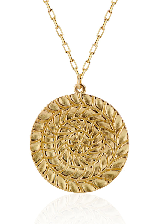 Named for Busby Berkely’s wife, the Etta necklace is a kaleidoscopic wonder that mirrors his elaborate geometric choreography. Four concentric circles, each detailed by hand, create a hypnotic and substantial pendant necklace as timeless as Berkeley’s black and white films.