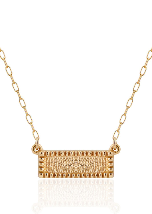 Let the details that speak to you come into focus. The Frame necklace is a study in craftsmanship, at once delicate and substantial. Beaded framework surrounds textured gold for a timeless and eye-catching necklace.