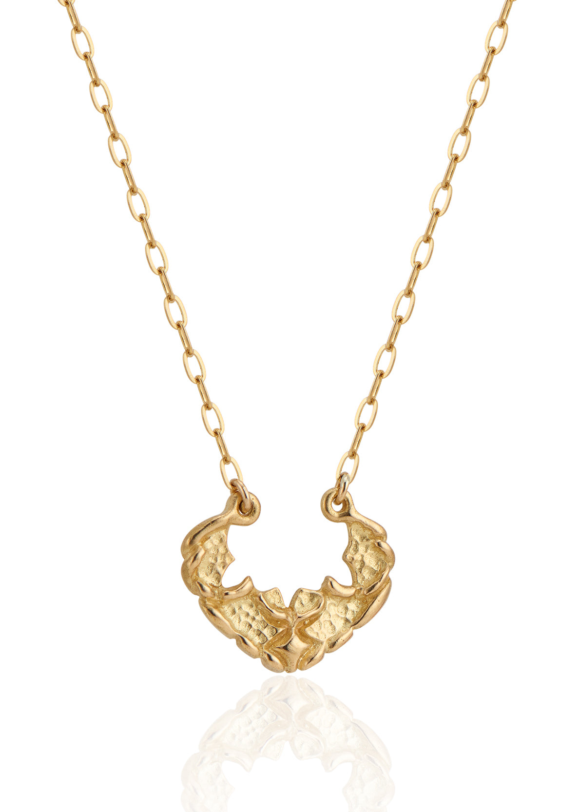 Named for the goddess of the sea, the Sedna necklace mirrors the undulating rhythm of the ocean. Gold waves expand and recede, revealing detailed texture that invites the eye to linger—a piece evocative of infinite strength and power.