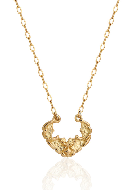 Named for the goddess of the sea, the Sedna necklace mirrors the undulating rhythm of the ocean. Gold waves expand and recede, revealing detailed texture that invites the eye to linger—a piece evocative of infinite strength and power.
