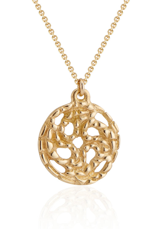 A passport to another world. With its intricate hand-carved texture and open-work design, the Token necklace calls to mind a lucky coin that opens the gate to where adventure lies, just beyond.