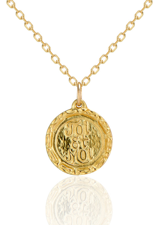 Inspired by “toi et moi” engagement rings from centuries past, the Toi et Moi necklace is a gold pendant engraved by hand to read “Toi et Moi” on one side and “You and Me” on the other. Delicate carving on the edges showcases the beauty of the gold—a piece that’s romantic, sweet, and a promise of things to come.